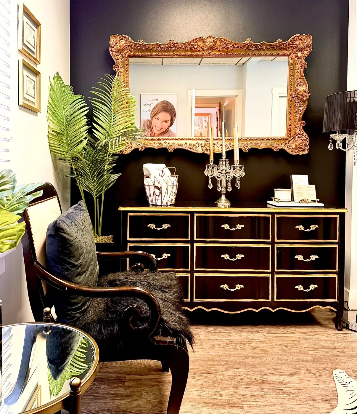 Interior of Silky Smooth Waxing Studio featuring its ornate gold mirror and black-and-gold furnishings